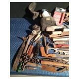 tote of tools with tool belt and knee pads