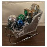 Cheery Holiday Decor including Sleighs, Candle, Wall Decor, Faux Greenery and More!