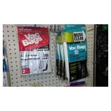 Large assortment of vacuum cleaner bags.