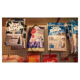 Large assortment of vacuum cleaner bags.