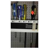 Assorted Screwdrivers with peg board organizer and Pry Bar.