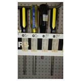 Assorted Screwdrivers with peg board organizer and Pry Bar.