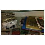 Assortment Keychains, camera, calculators and more.
