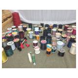 Collection of Sewing Thread Spools with Wicker Storage Basket and Sewing Stool