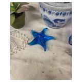 Collection of Decorative Items: Blue Glass Fish, Yellow Metal Flowers, and More