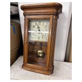 Vintage Wall Clock with Pendulum and Ornate Detailing