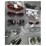 25 pair of adult sunglasses (a couple are readers)