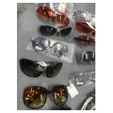 25 pair of adult sunglasses (a couple are readers)