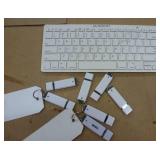 group of electronics - switch, 6 remotes, usb drives, webcam, laptop drives