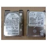 group of electronics - switch, 6 remotes, usb drives, webcam, laptop drives