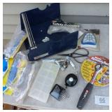 warehouse items, tape/label roll holder, safety goggles, ratchet, bearings, dust mask, zip extending key ring, soldering iron heads