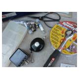 warehouse items, tape/label roll holder, safety goggles, ratchet, bearings, dust mask, zip extending key ring, soldering iron heads