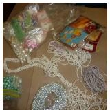 Beadwork supplies, handiwork, décor, water bottles all in a crate