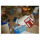 Beadwork supplies, handiwork, décor, water bottles all in a crate