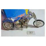 Toy motorcycle, quite heavy, about 8 inches long