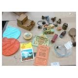 Group of vintage items including wood bird toothpick holder, cast iron bells, mini wood shaver