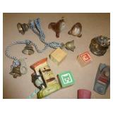 Group of vintage items including wood bird toothpick holder, cast iron bells, mini wood shaver