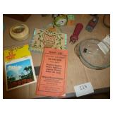 Group of vintage items including wood bird toothpick holder, cast iron bells, mini wood shaver