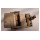 Group of vintage items including wood bird toothpick holder, cast iron bells, mini wood shaver