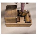 Group of vintage items including wood bird toothpick holder, cast iron bells, mini wood shaver