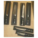 Set of kitchen knives and a sharpener