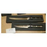 Set of kitchen knives and a sharpener