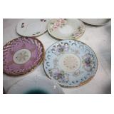 Collection of Vintage Porcelain Cups and Saucers with Floral and Ornate Designs