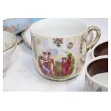 Collection of Vintage Porcelain Cups and Saucers with Floral and Ornate Designs