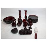 Collection of Ruby Red Glassware Including Goblets, Candlesticks, and Decorative Pieces