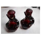 Collection of Ruby Red Glassware Including Goblets, Candlesticks, and Decorative Pieces