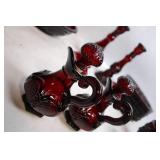 Collection of Ruby Red Glassware Including Goblets, Candlesticks, and Decorative Pieces