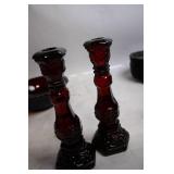 Collection of Ruby Red Glassware Including Goblets, Candlesticks, and Decorative Pieces