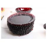 Collection of Ruby Red Glassware Including Goblets, Candlesticks, and Decorative Pieces