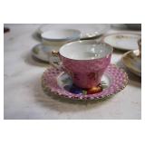 Elegant Collection of Vintage Porcelain Teacups, Saucers, and Plates