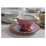 Elegant Collection of Vintage Porcelain Teacups, Saucers, and Plates