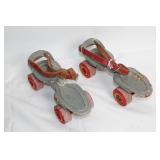 Vintage Adjustable Metal Roller Skates with Red Wheels