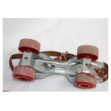 Vintage Adjustable Metal Roller Skates with Red Wheels