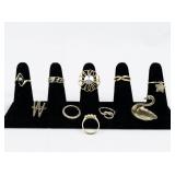 Set of ten  Gold Tone Base Metal Rings . Size 6.75-7.25.