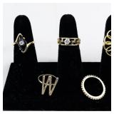 Set of ten  Gold Tone Base Metal Rings . Size 6.75-7.25.