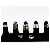 Set of Seven Gold Tone Base Metal Rings . Size 6-6.5.