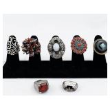 Set of seven  Silver Tone Base Metal Rings. Size 8--9.