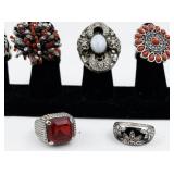 Set of seven  Silver Tone Base Metal Rings. Size 8--9.