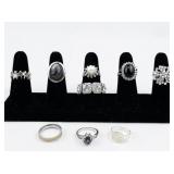 Set of eight  Silver Tone Base Metal Rings . Size 8.75-9.75.