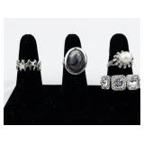 Set of eight  Silver Tone Base Metal Rings . Size 8.75-9.75.