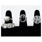 Set of eight  Silver Tone Base Metal Rings . Size 8.75-9.75.