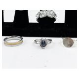 Set of eight  Silver Tone Base Metal Rings . Size 8.75-9.75.