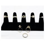 Set of eight  Gold Tone Base Metal Rings . Size 6-6.75.