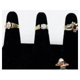 Set of eight  Gold Tone Base Metal Rings . Size 6-6.75.