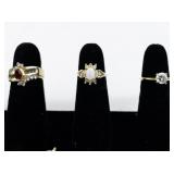 Set of eight  Gold Tone Base Metal Rings . Size 6-6.75.