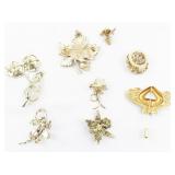 Group of 8 Gold Tone Base Metal Brooches.